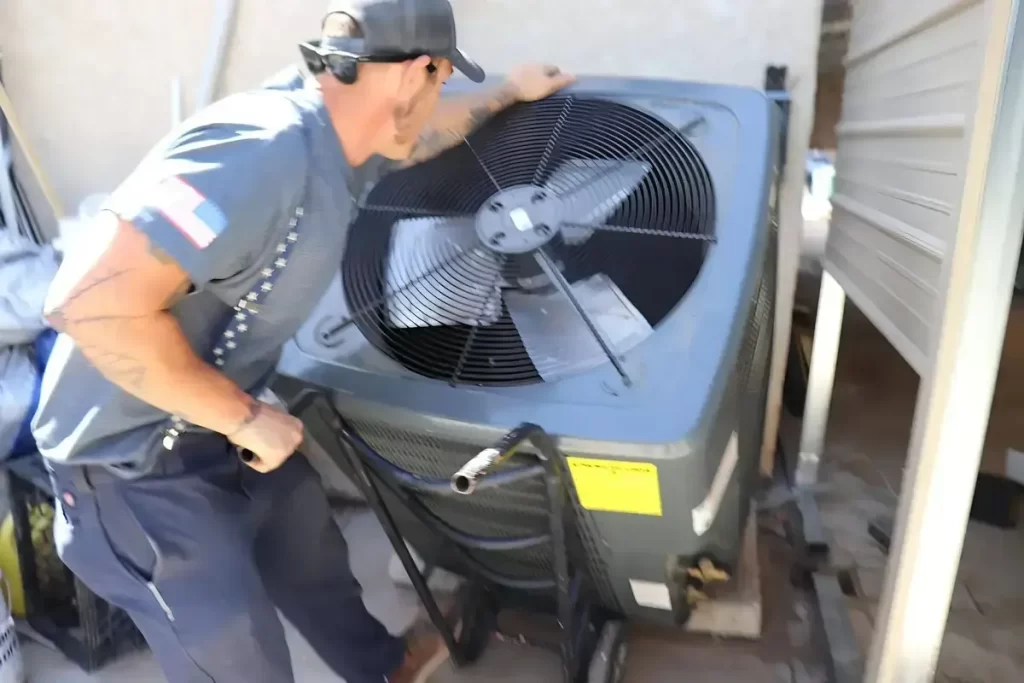 Owner of Working Class Heating and Air Conditioning Services installing an HVAC unit for improved heating, cooling, indoor air quality, and energy efficiency in residential and commercial properties.