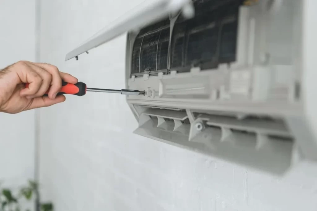 HVAC technician repairing an air conditioning unit to improve cooling efficiency and air quality for homes and businesses in Antelope Valley, Palmdale, and Lancaster. Working Class HVAC specializes in professional HVAC repairs, installations, and maintenance services.